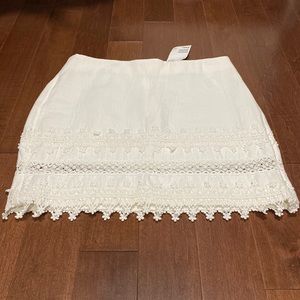 Brand new white mini skirt with lace